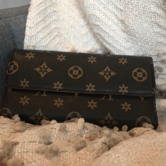 Handbags - Medium Brown Wallet. Logo Print. Handbags - Medium Brown Wallet. Logo Print.